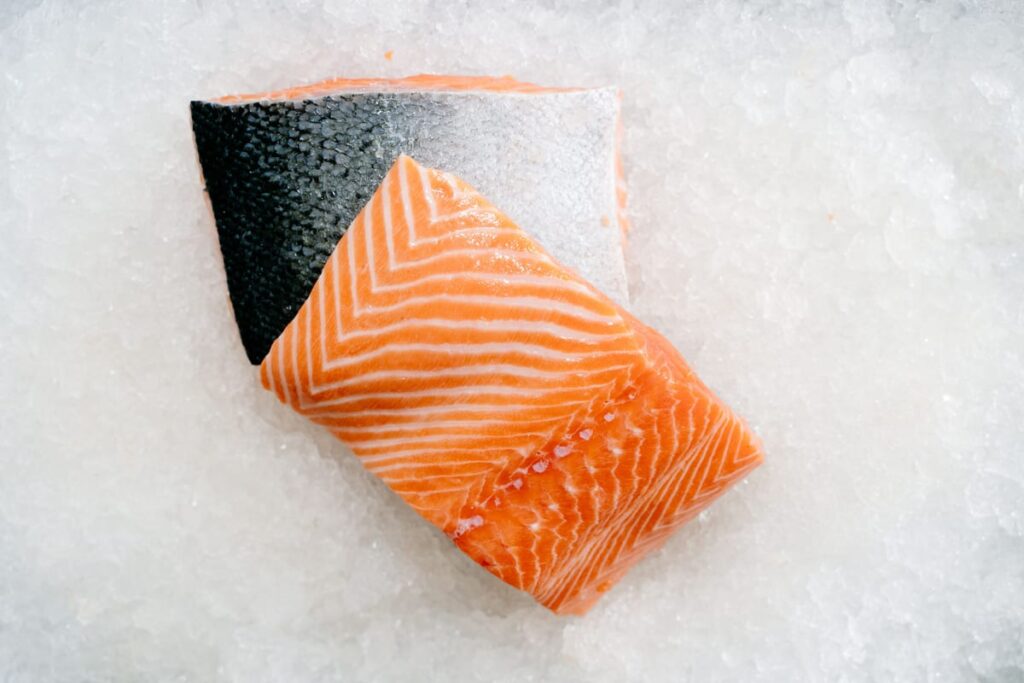 Raw salmon, illustrating an article about salmon oil for dogs and cats